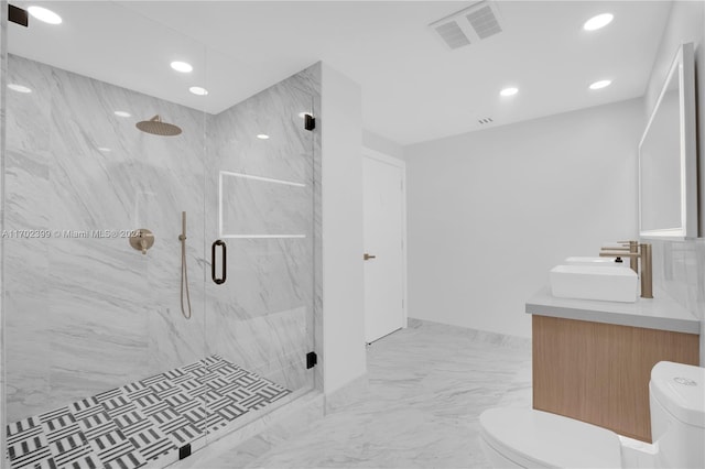 bathroom with vanity, an enclosed shower, and toilet