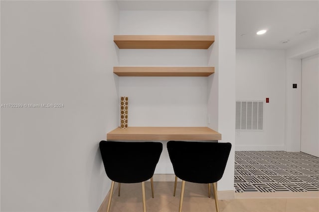 dining space featuring tile patterned floors