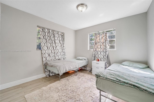 bedroom with light wood-type flooring