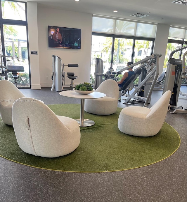 exercise room featuring carpet