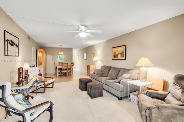 living room with carpet floors and ceiling fan