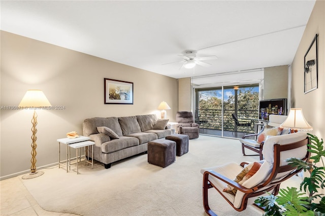 living room featuring tile patterned floors and ceiling fan