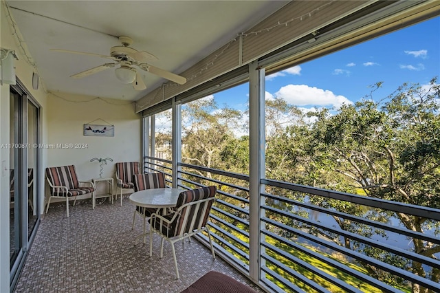 sunroom / solarium with ceiling fan