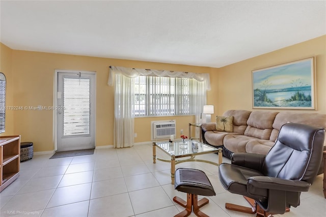 living room featuring an AC wall unit and light tile patterned flooring