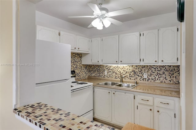 kitchen featuring white appliances, sink, backsplash, and white cabinets