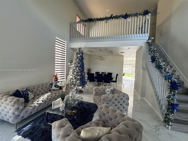 living room featuring a high ceiling