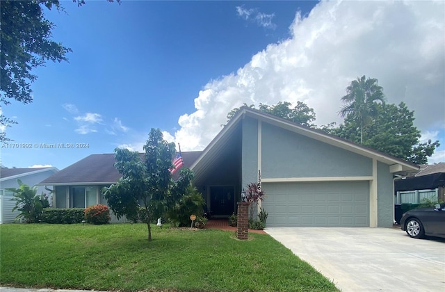 view of front facade with a garage and a front yard