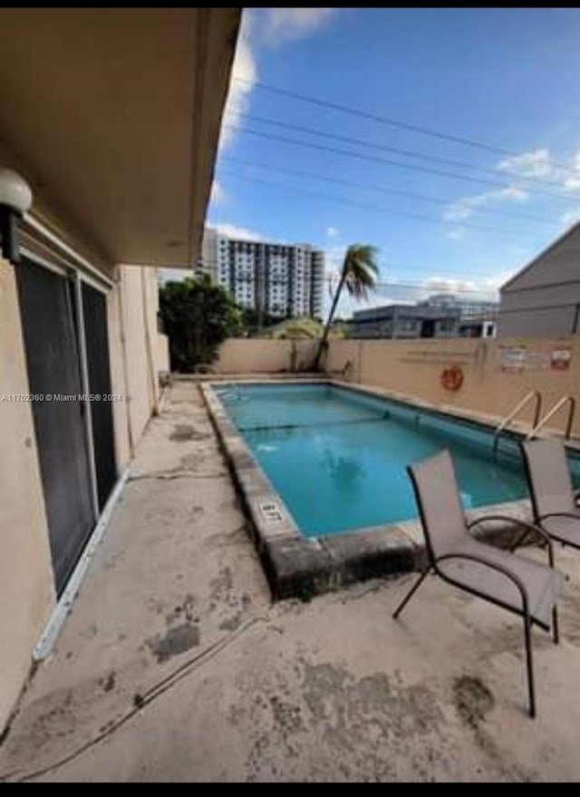 pool with a patio