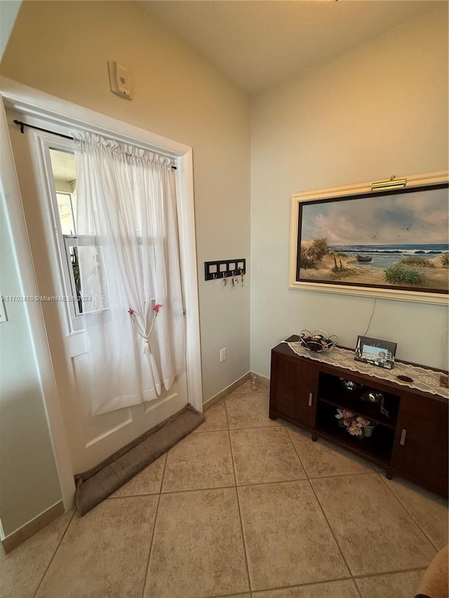 doorway featuring light tile patterned floors