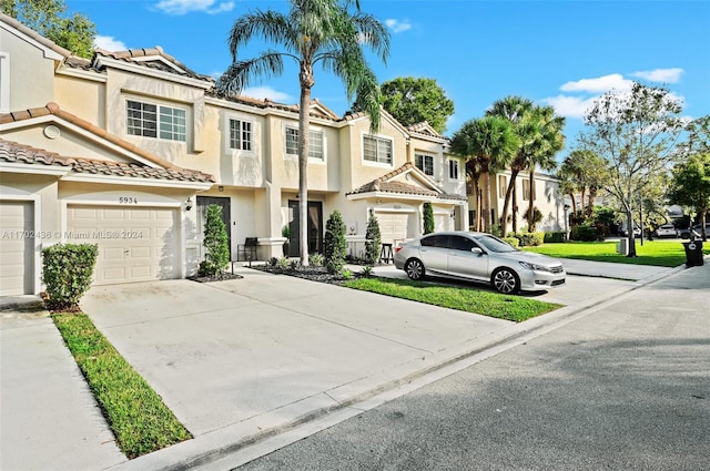 multi unit property featuring a garage