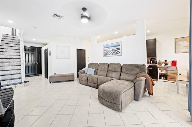 living room featuring ceiling fan and light tile patterned floors