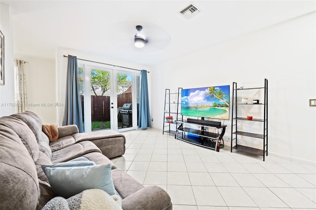 living room featuring light tile patterned floors, french doors, and ceiling fan