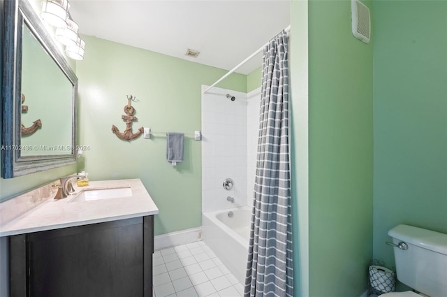 full bathroom with tile patterned flooring, vanity, shower / tub combo, and toilet