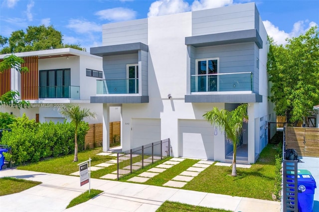 contemporary house with a garage and a front yard