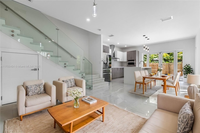 living room with french doors and sink