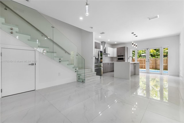 interior space with sink and french doors