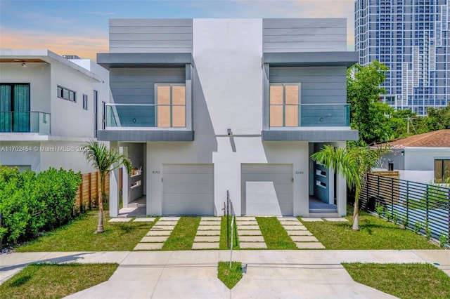 contemporary house with a balcony and a garage