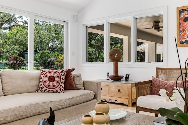 sunroom / solarium featuring ceiling fan and lofted ceiling