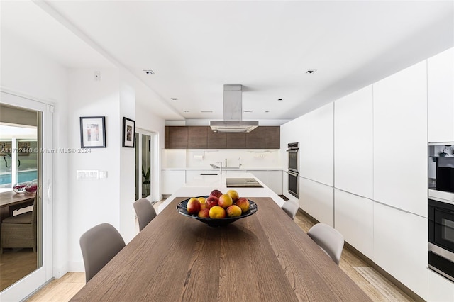 dining space featuring light hardwood / wood-style flooring