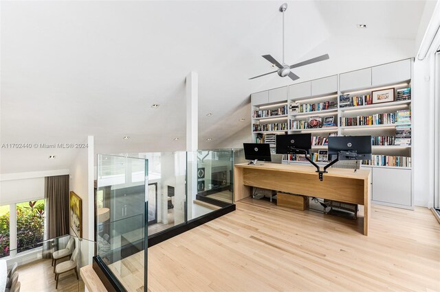 office featuring ceiling fan, vaulted ceiling, and light hardwood / wood-style flooring