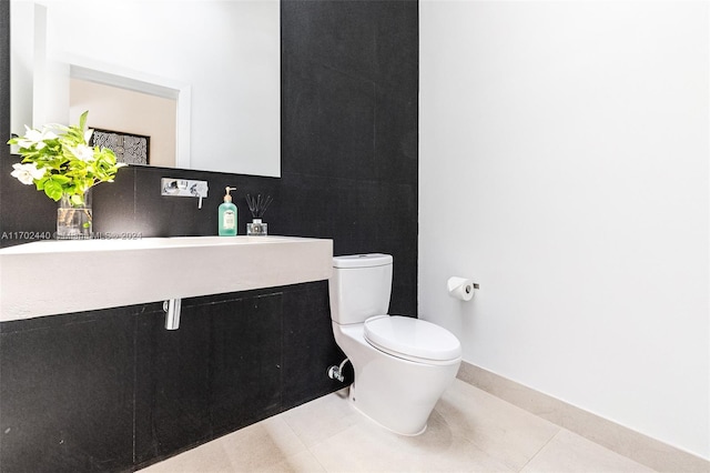 bathroom featuring tile patterned flooring and toilet