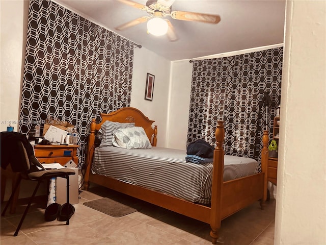 bedroom with ceiling fan and light tile patterned flooring