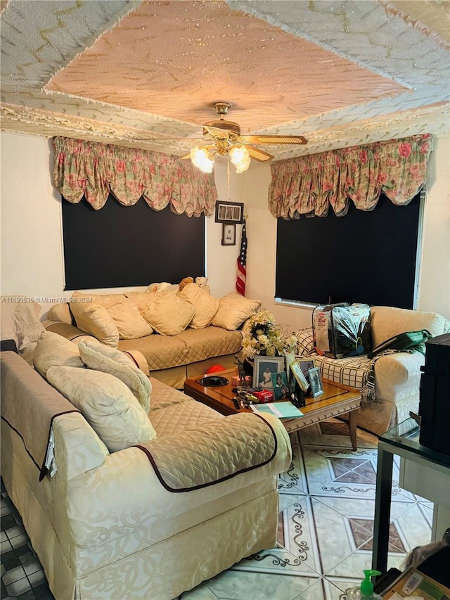 tiled living room featuring ceiling fan