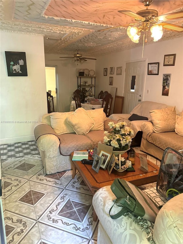 tiled living room featuring ceiling fan