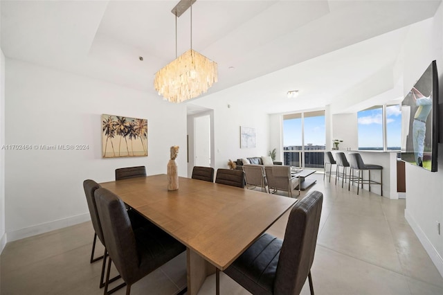 dining area with a notable chandelier