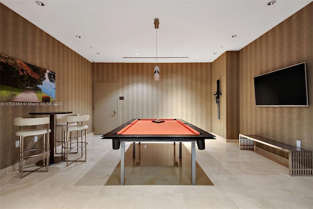 recreation room with wooden walls and billiards