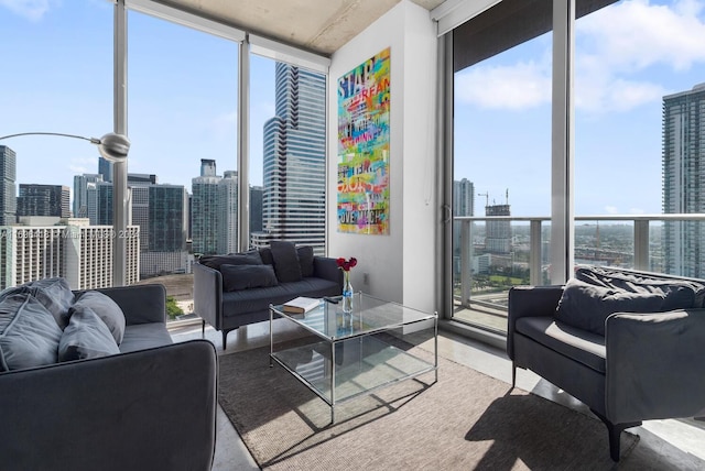 living room featuring floor to ceiling windows