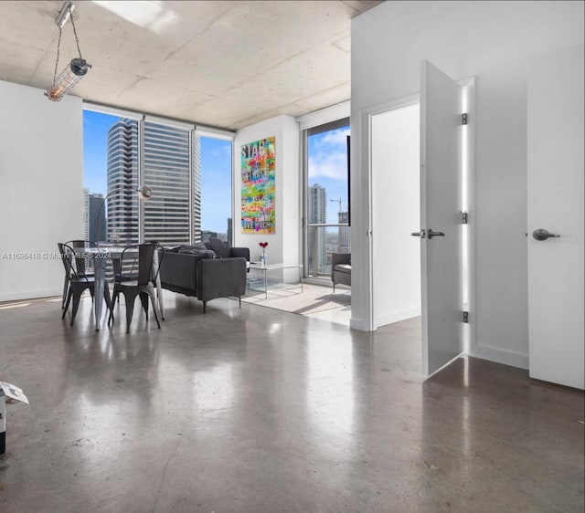 dining room featuring floor to ceiling windows