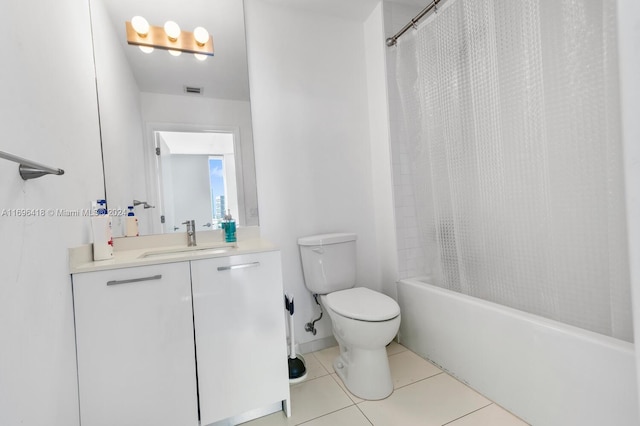 full bathroom with toilet, shower / tub combo, vanity, and tile patterned floors