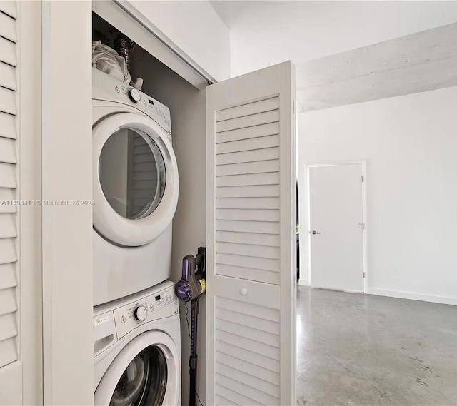 clothes washing area with stacked washer / drying machine