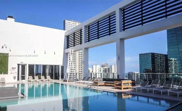 view of swimming pool featuring a patio area