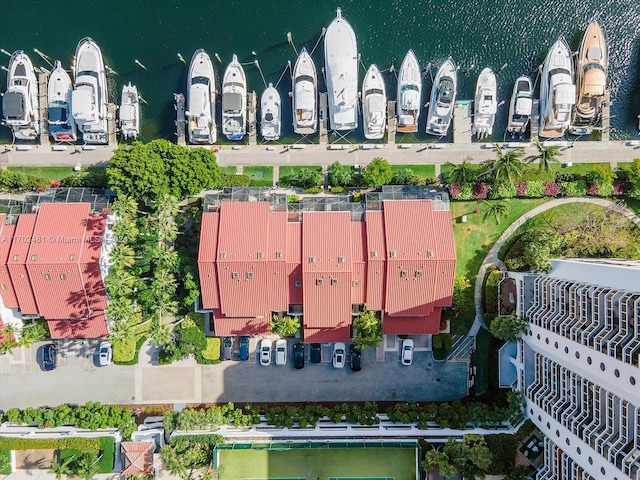 birds eye view of property with a water view