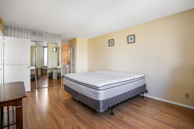 bedroom featuring hardwood / wood-style flooring