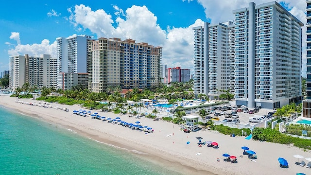 bird's eye view with a view of the beach and a water view