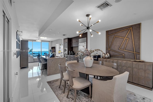 dining space featuring a notable chandelier, floor to ceiling windows, and light tile patterned floors