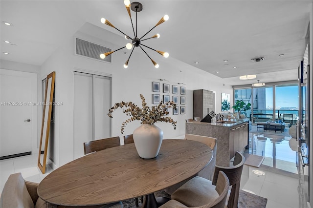 tiled dining area featuring a notable chandelier