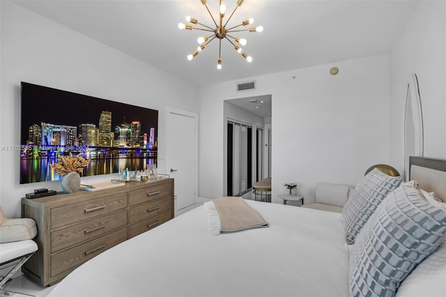 bedroom featuring an inviting chandelier