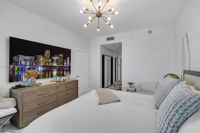 900 Biscayne Blvd Unit 5208, Miami, FL 33132 - bedroom featuring a chandelier