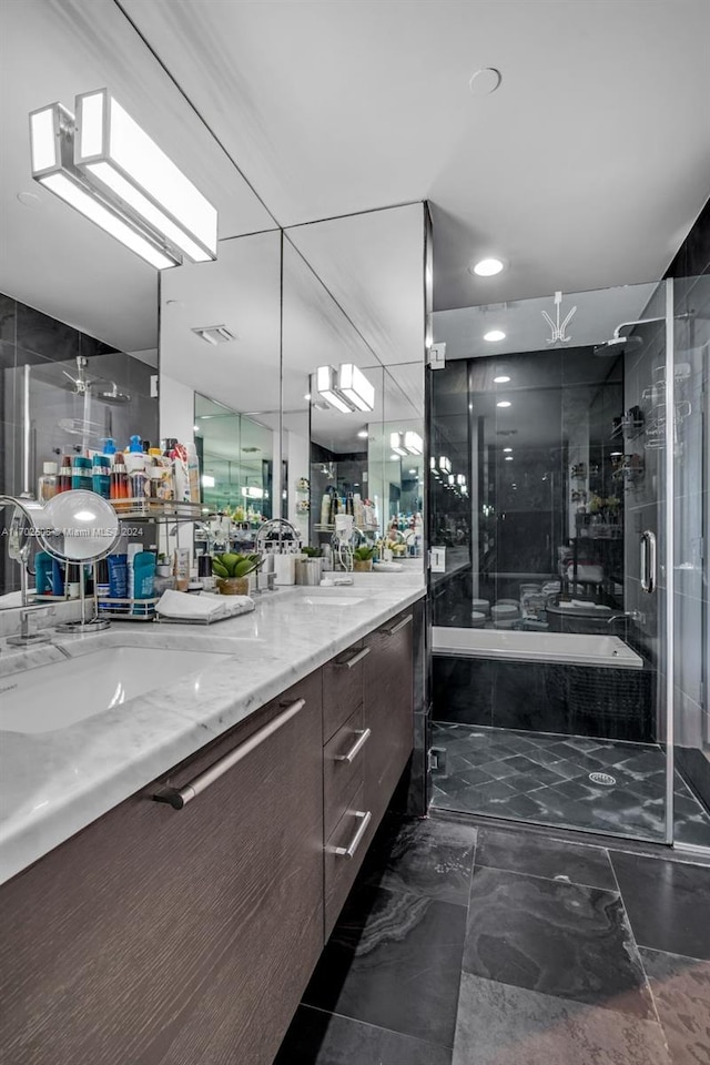 bathroom featuring vanity and plus walk in shower