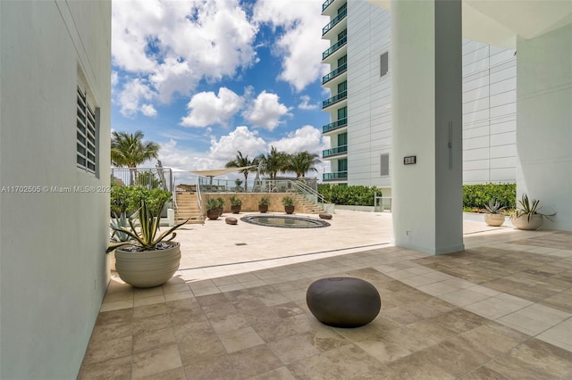 view of patio featuring a community hot tub