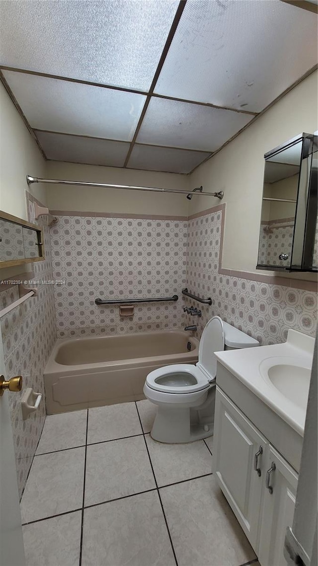 full bathroom with toilet, tile patterned flooring, vanity, and tub / shower combination