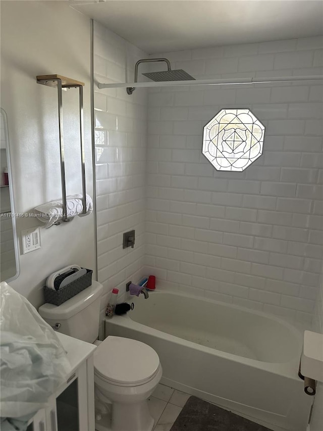 full bathroom with tile patterned flooring, a healthy amount of sunlight, tiled shower / bath combo, and toilet