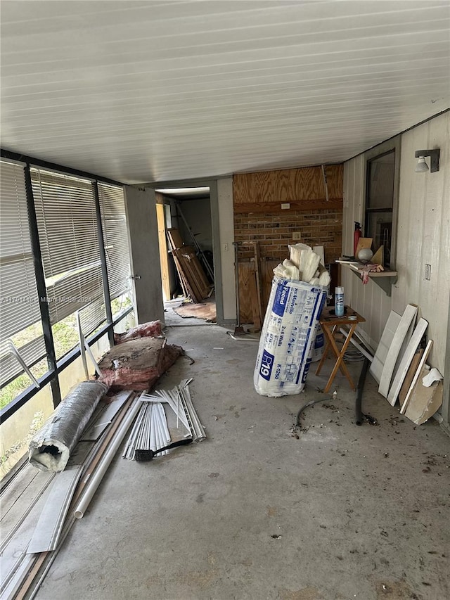 misc room featuring concrete flooring and a wealth of natural light