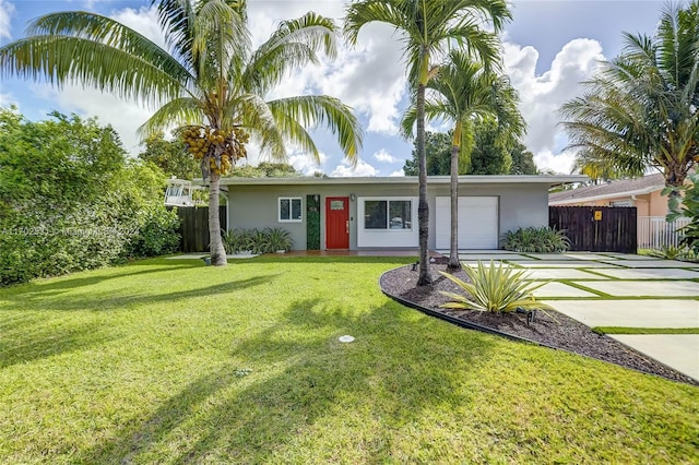 single story home with a front lawn and a garage