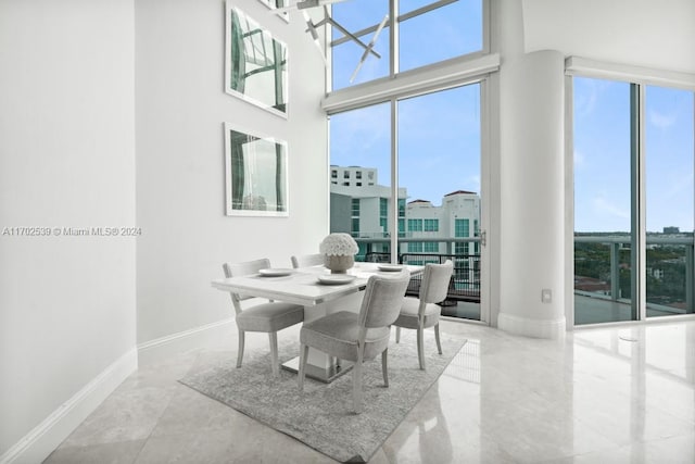 dining area featuring a high ceiling