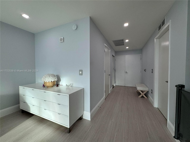 corridor featuring hardwood / wood-style flooring